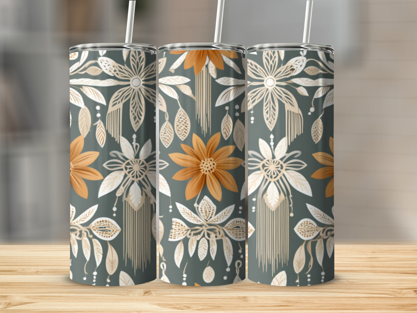 Three tumblers with a neutral floral and feather boho pattern.
