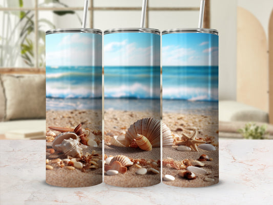 Three beach-themed tumblers with seashells and starfish on sand.