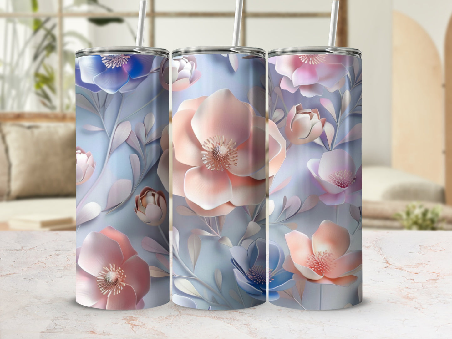 Three tumblers with a soft floral design in blue, pink, and purple hues.