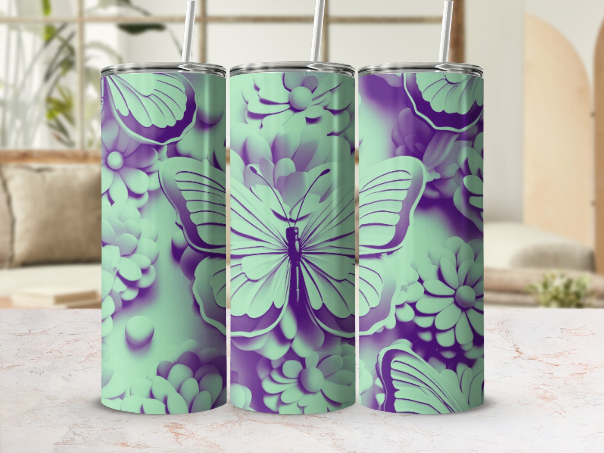 Mint green and purple butterfly and floral design on three tumblers.
