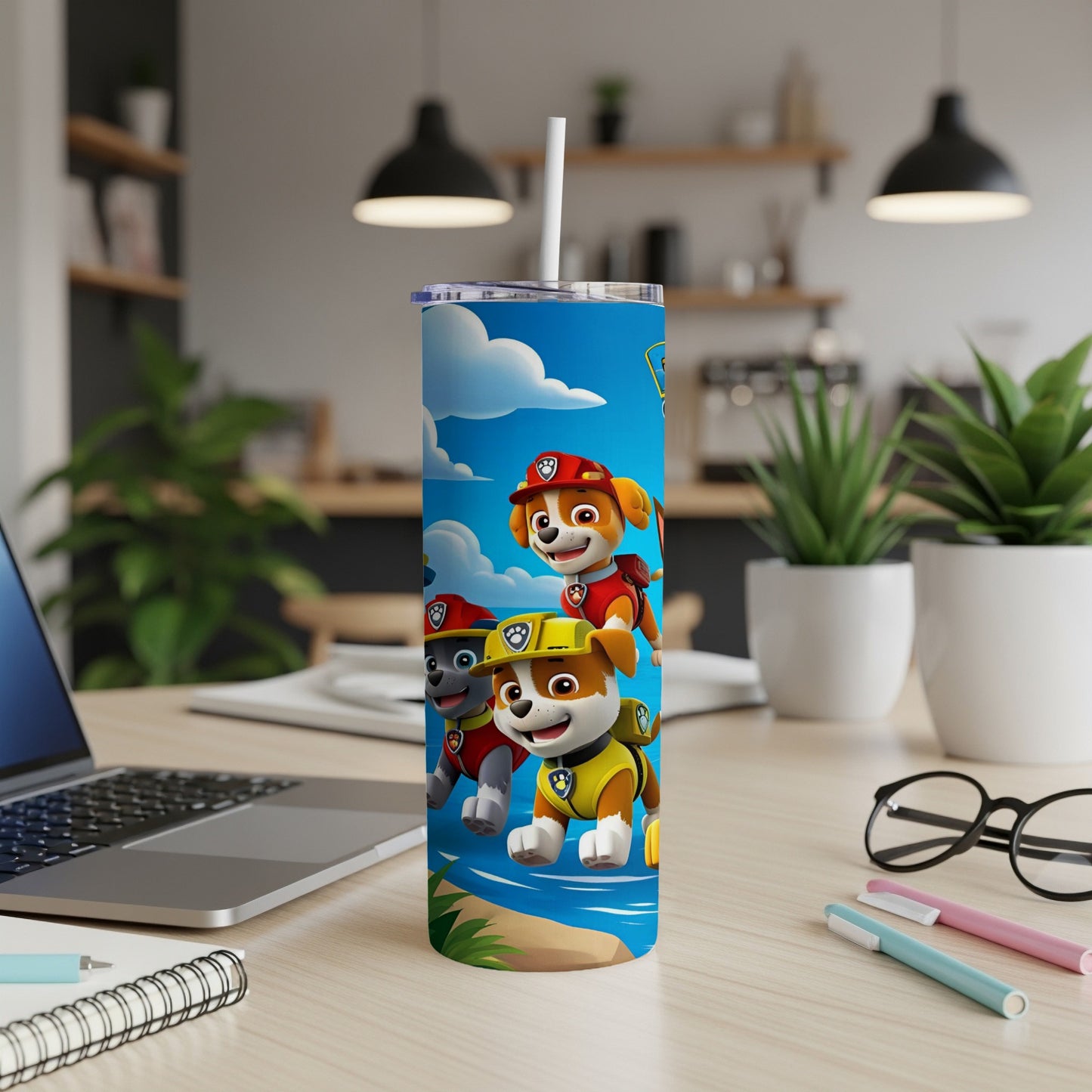 Paw Patrol characters Chase, Marshall, and Rubble on a blue tumbler.