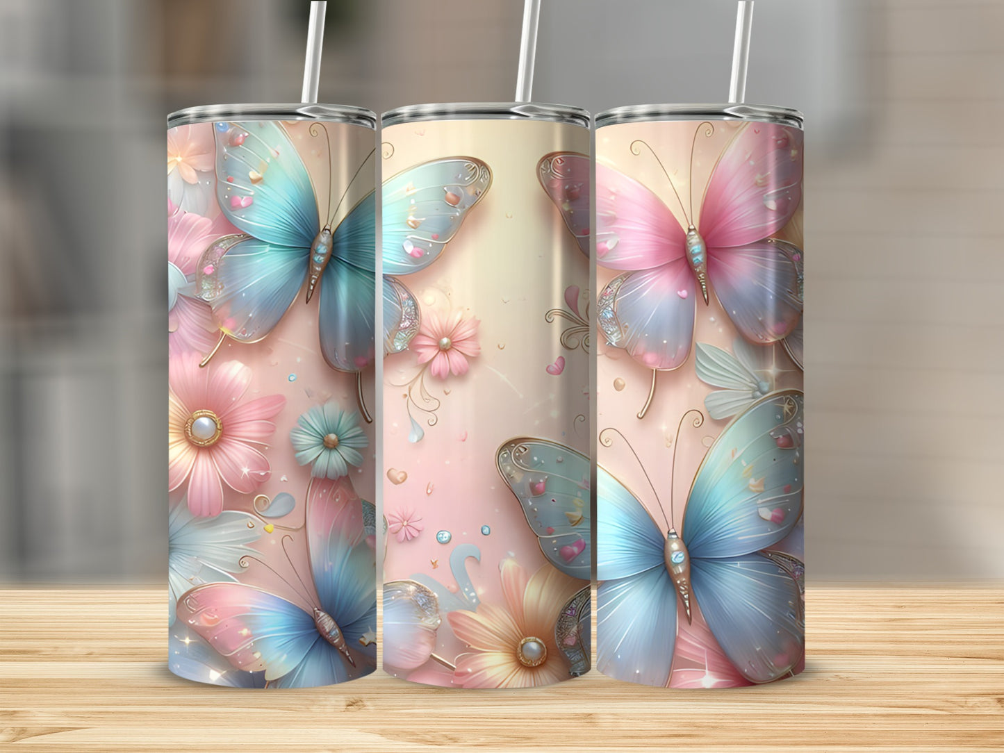 Three tumblers with pastel butterflies and floral designs.