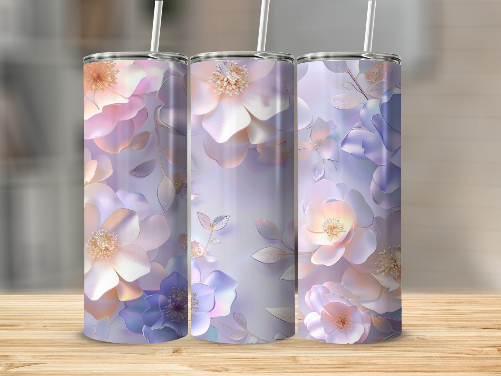 Three tumblers with iridescent floral designs in pastel colors.