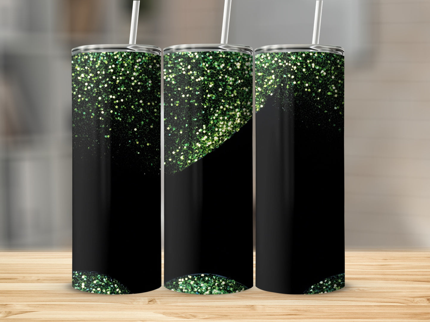 Black tumbler with scattered green glitter accents and a straw.