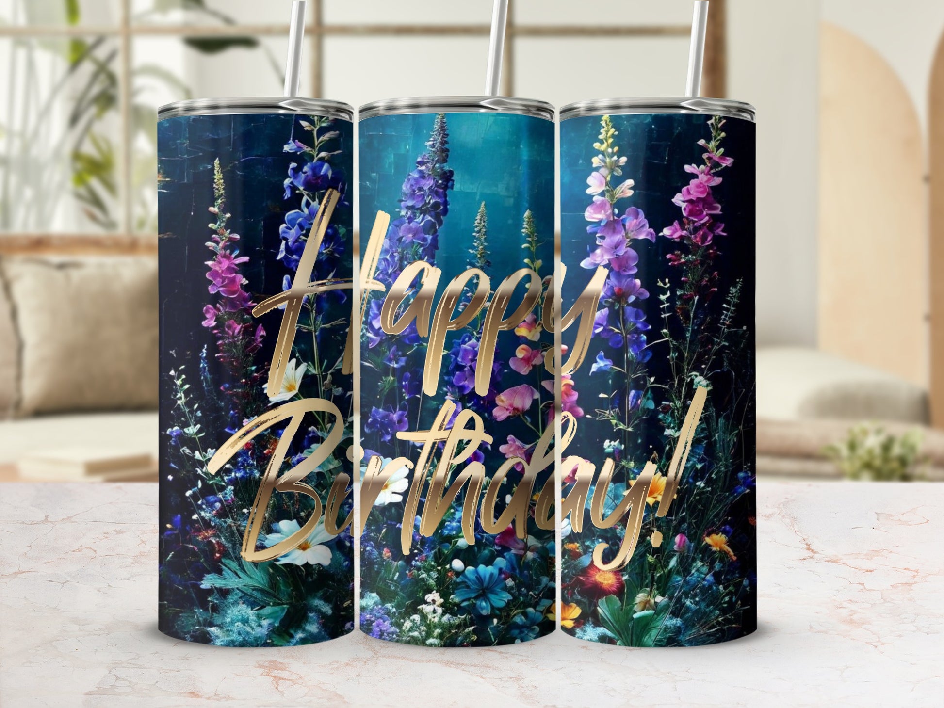 Floral Happy Birthday tumbler with gold lettering and straws.
