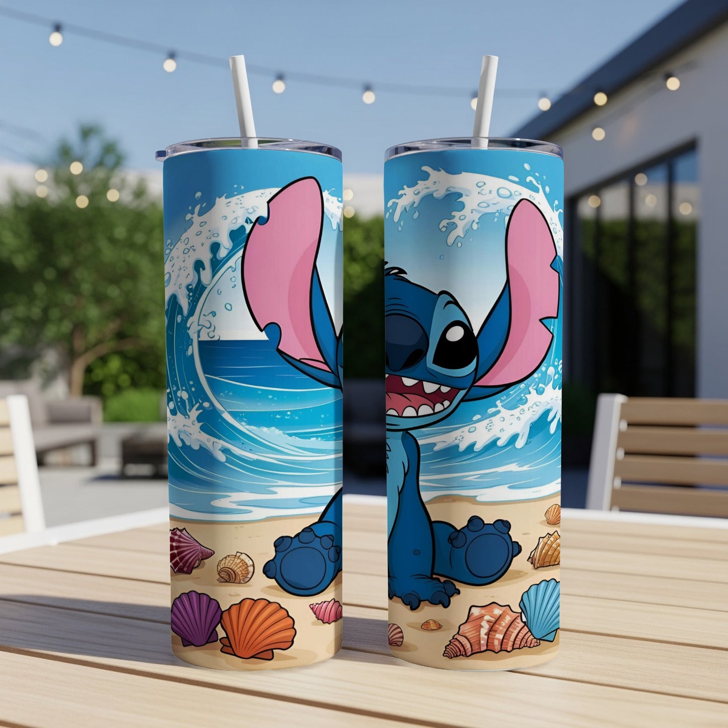 Stitch character on beach with seashells and waves design on two tumblers.