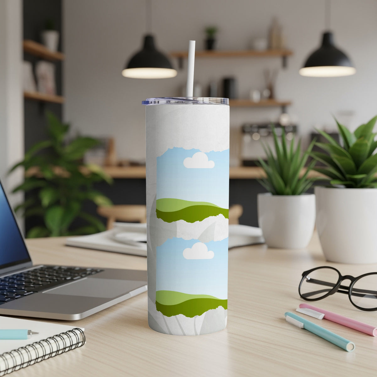 White tumbler with floating islands and sky design, with a straw.