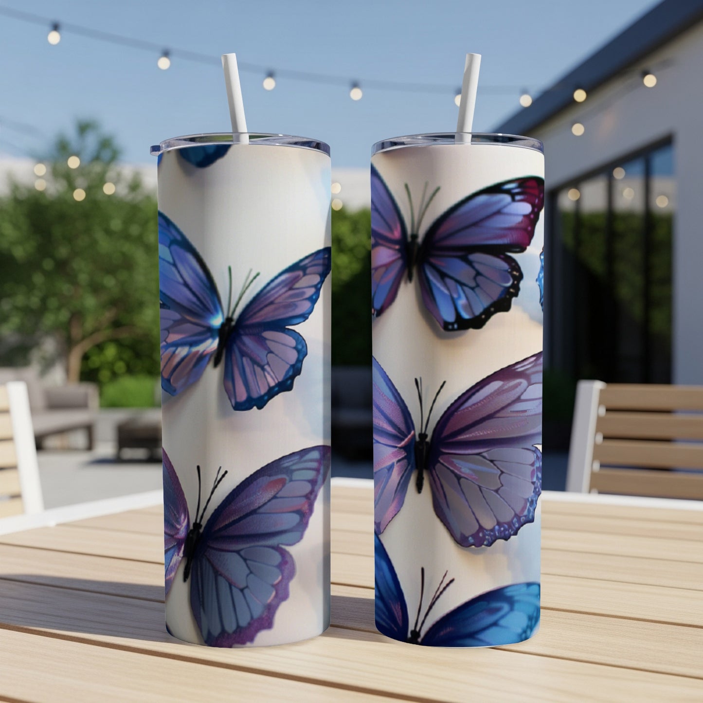 Two tumblers with a close-up pattern of purple and blue butterflies.