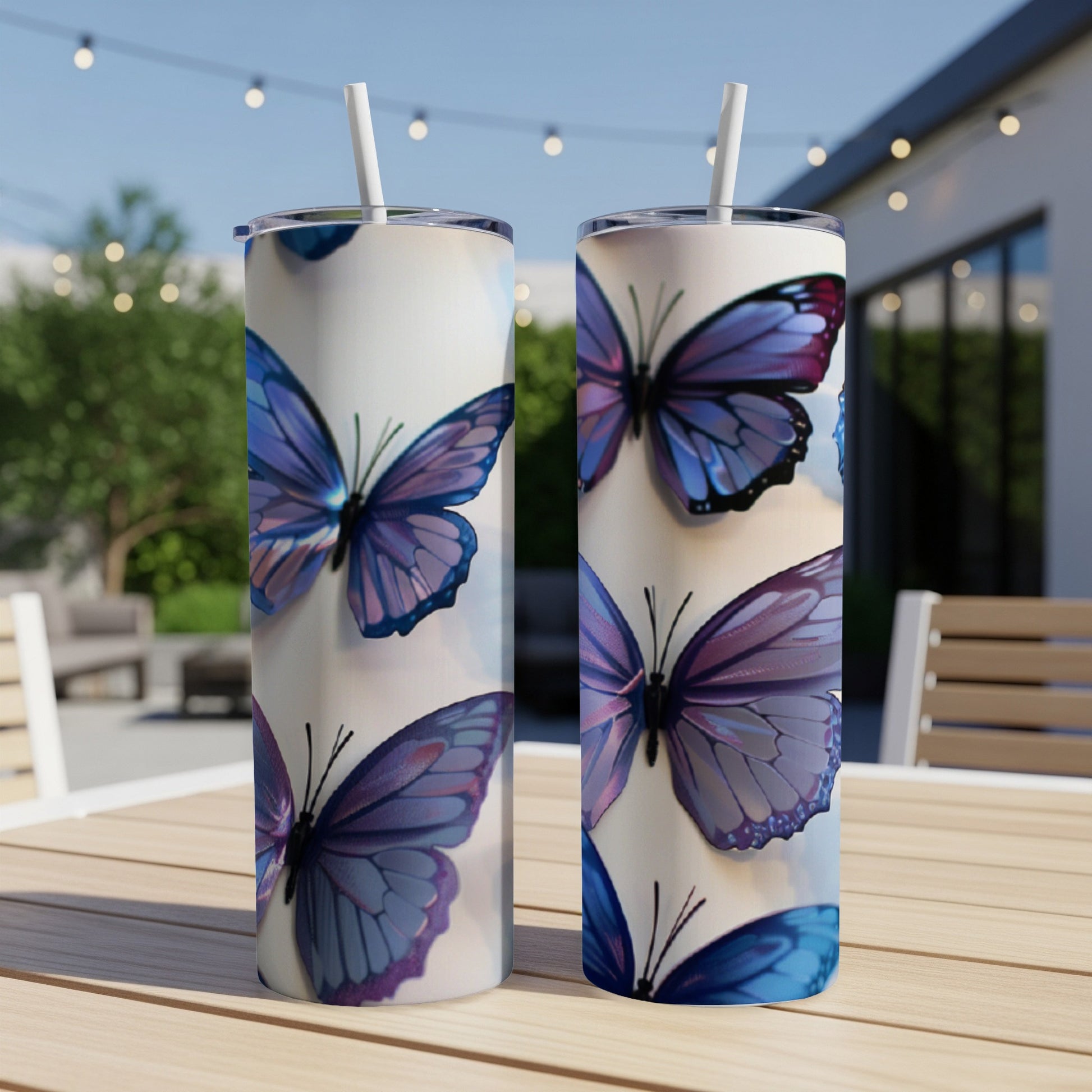 Two tumblers with a close-up pattern of purple and blue butterflies.