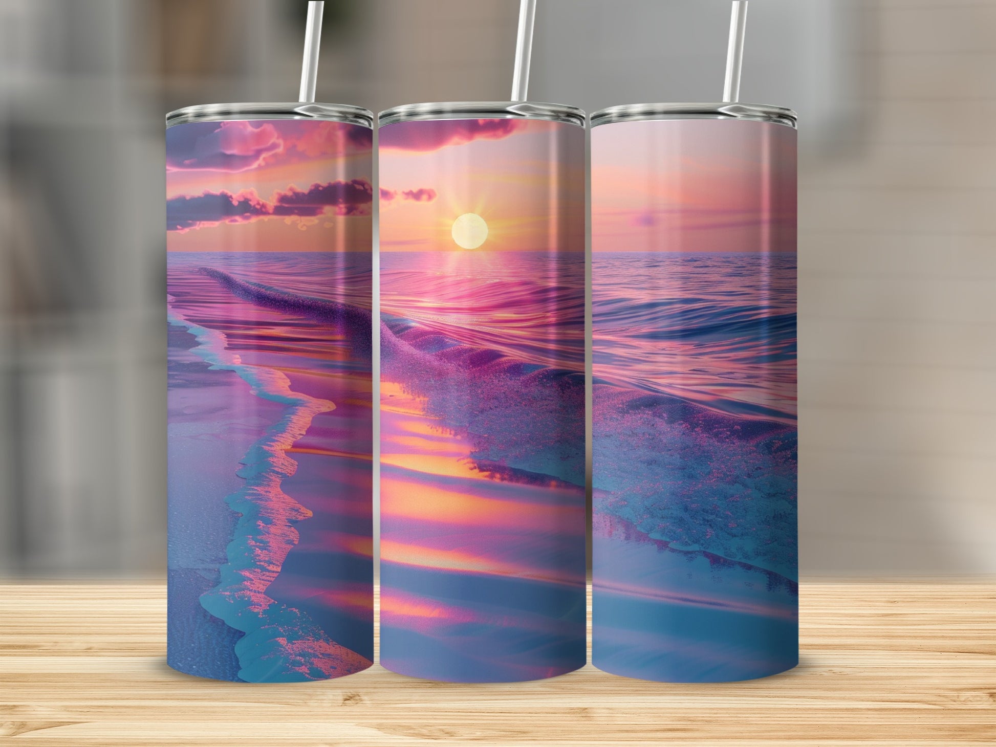 Three tumblers with a sunset beach ocean wave design.