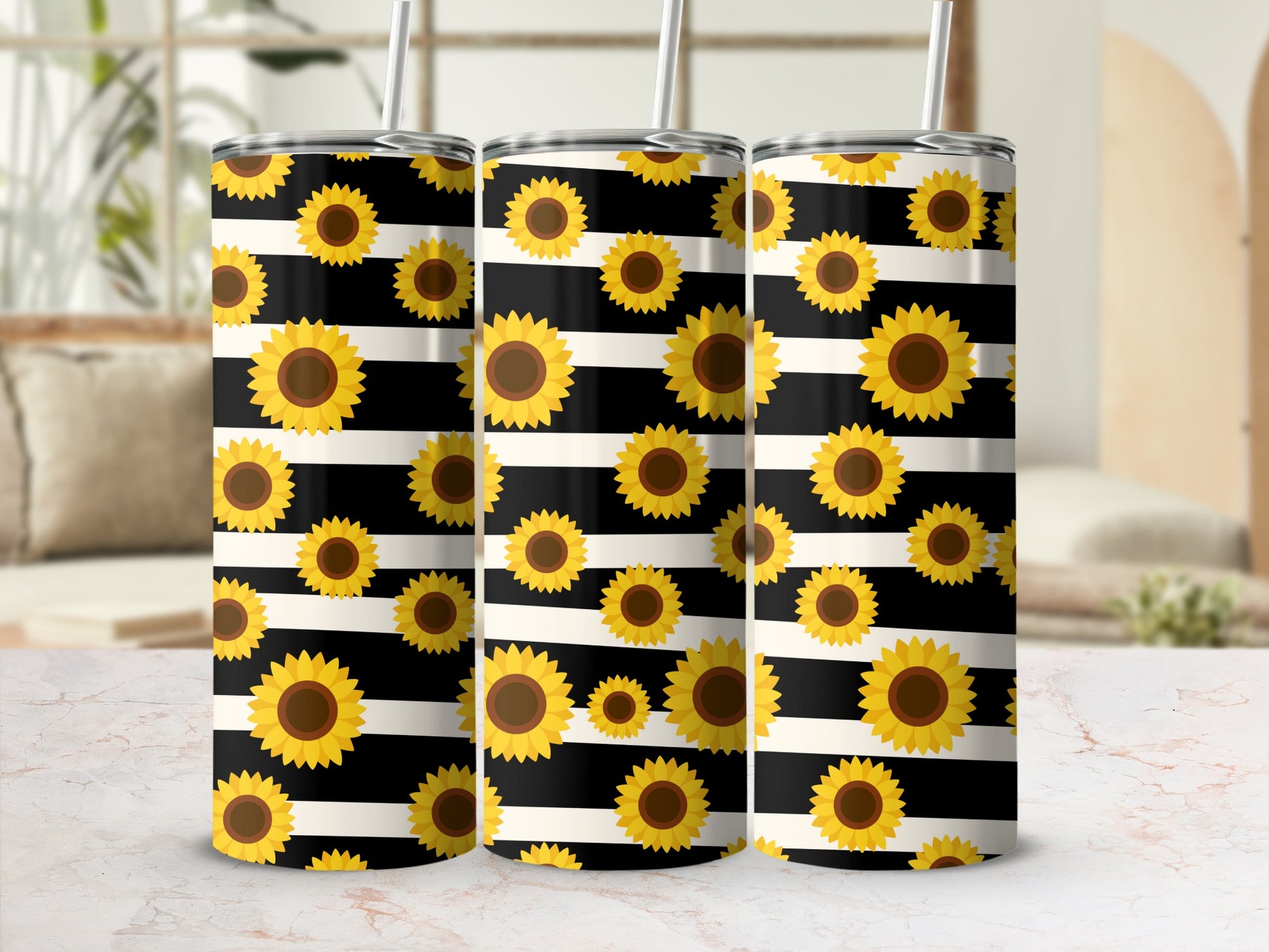 Three tumblers with black and white stripes and sunflower pattern.