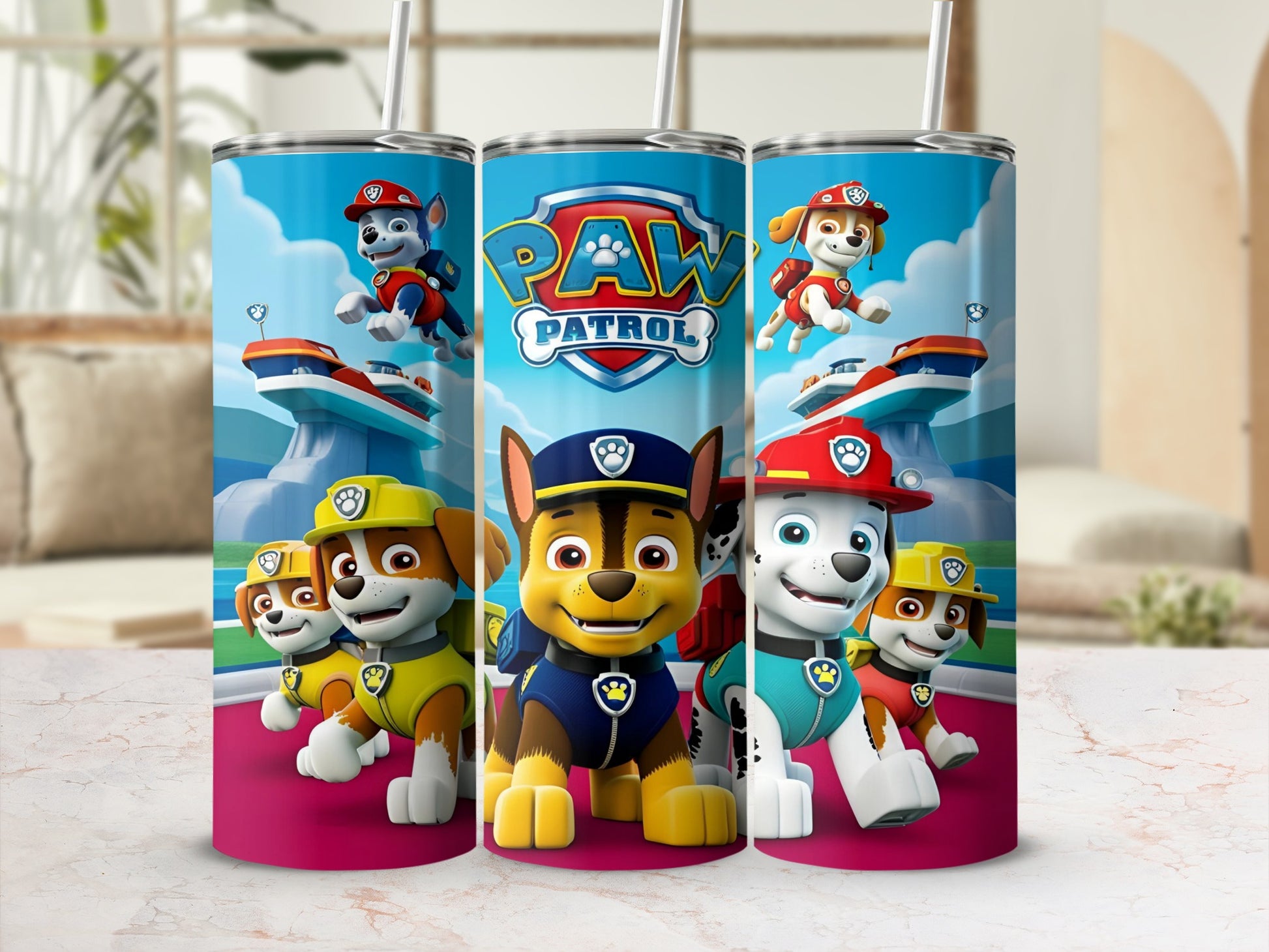 Paw Patrol characters on a blue tumbler with straws, displaying the Paw Patrol logo.