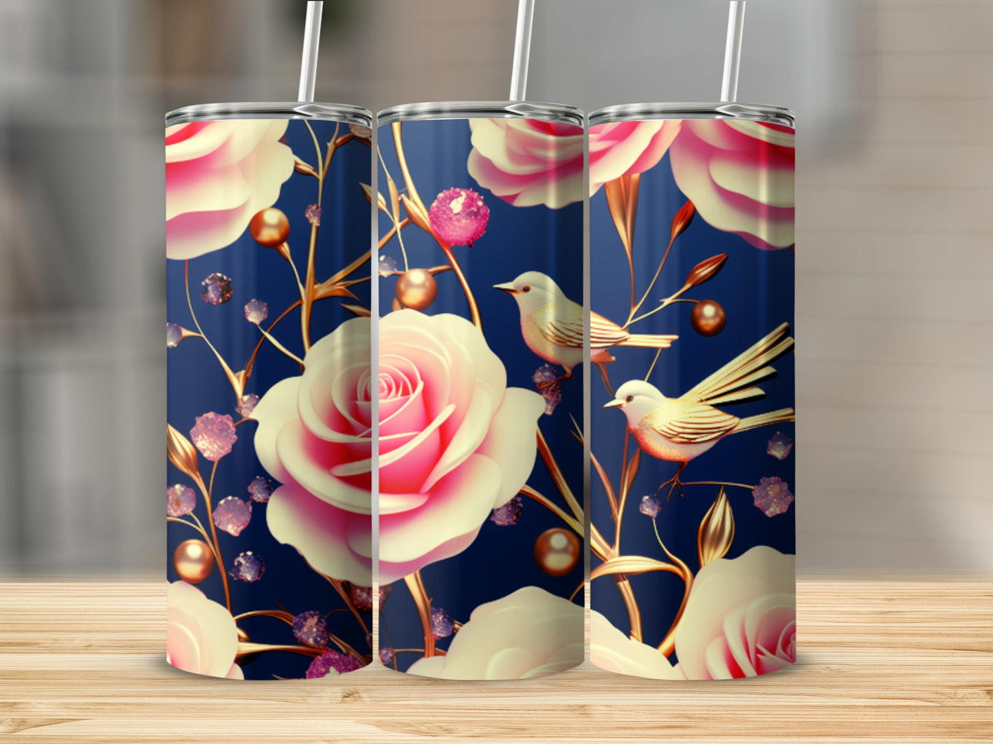 Three tumblers with pink roses, gold accents, and birds on a blue background.