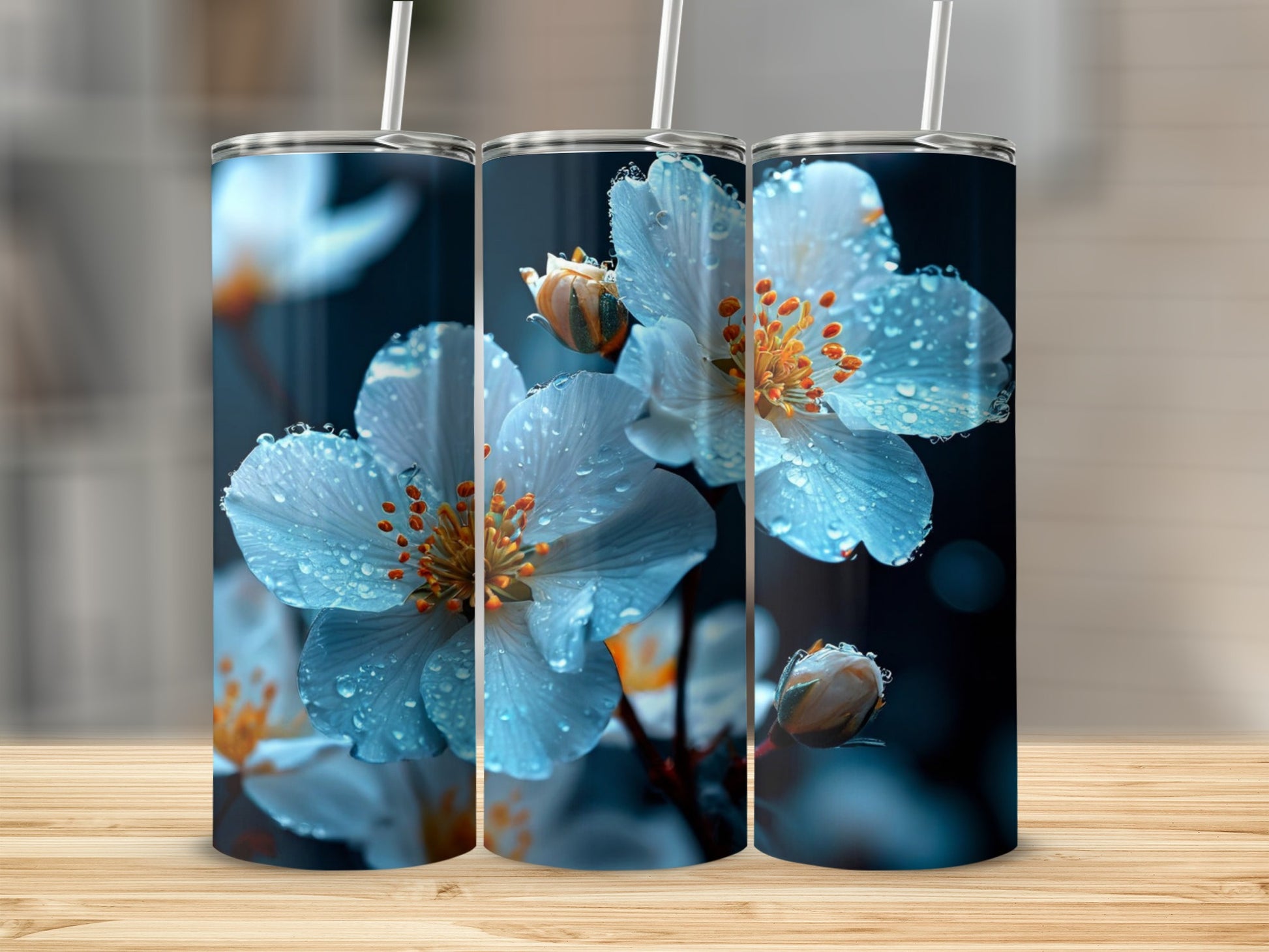 Three tumblers featuring close-up, dew-kissed white flowers with orange centers.