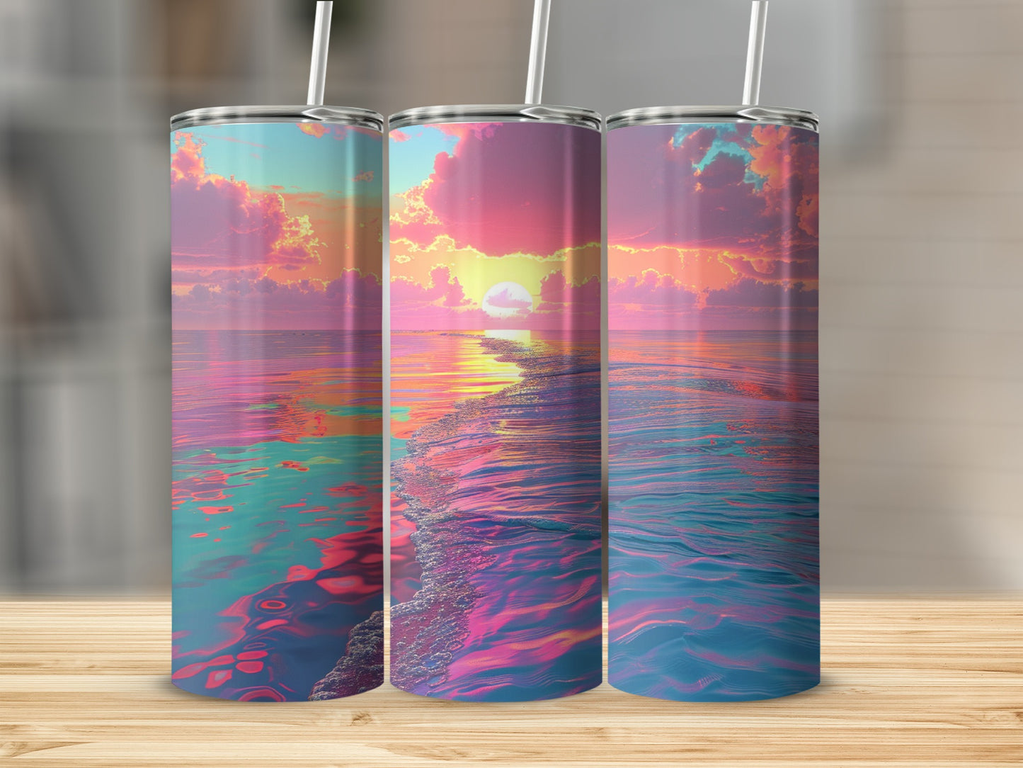 Three tumblers featuring a sunset ocean view with vibrant pink, purple, and blue colors.