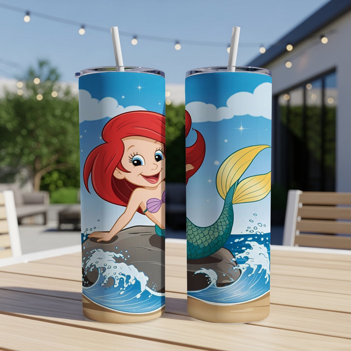 Ariel from The Little Mermaid on a rock with a blue sky and ocean.