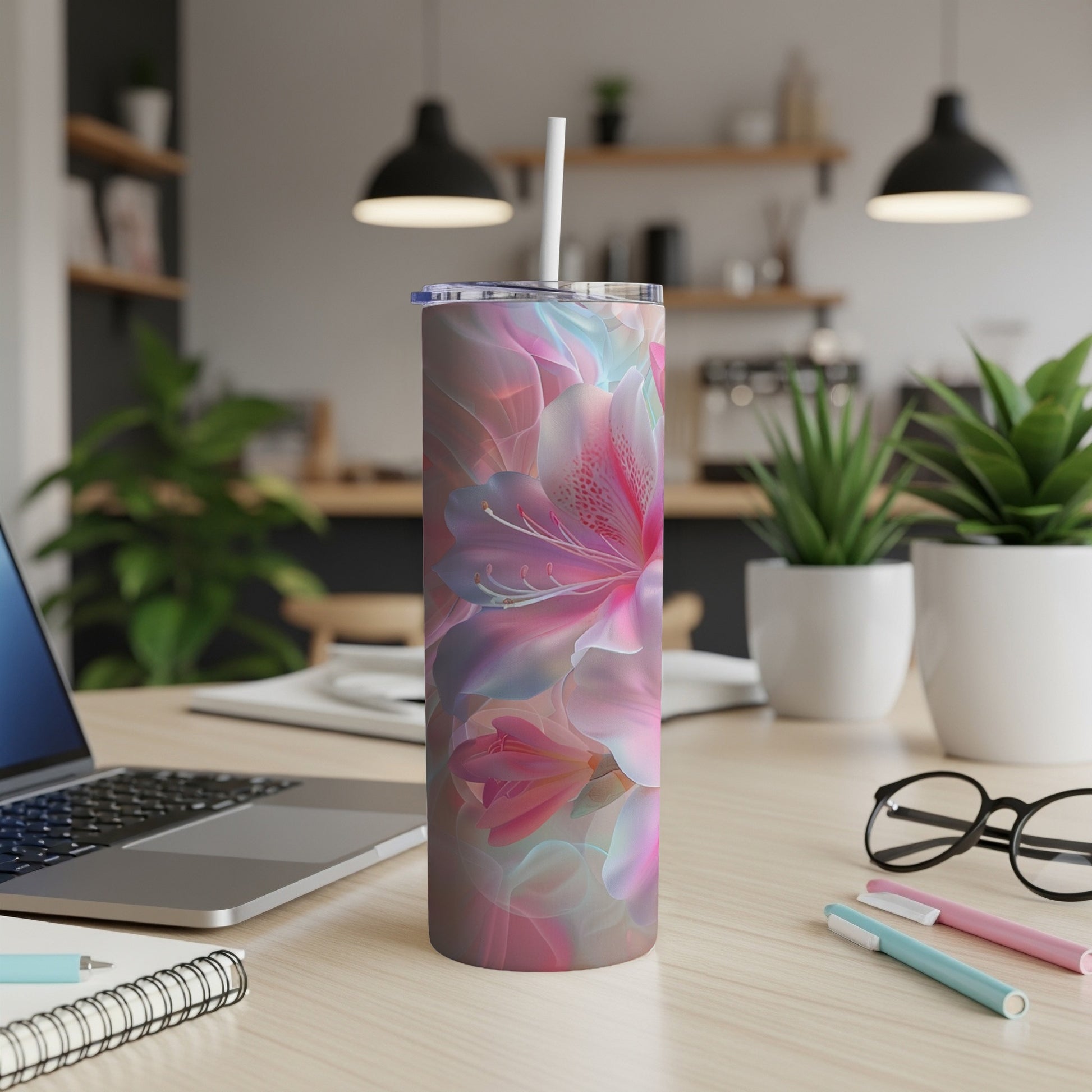 Tumbler with a floral abstract pattern in pinks and blues.