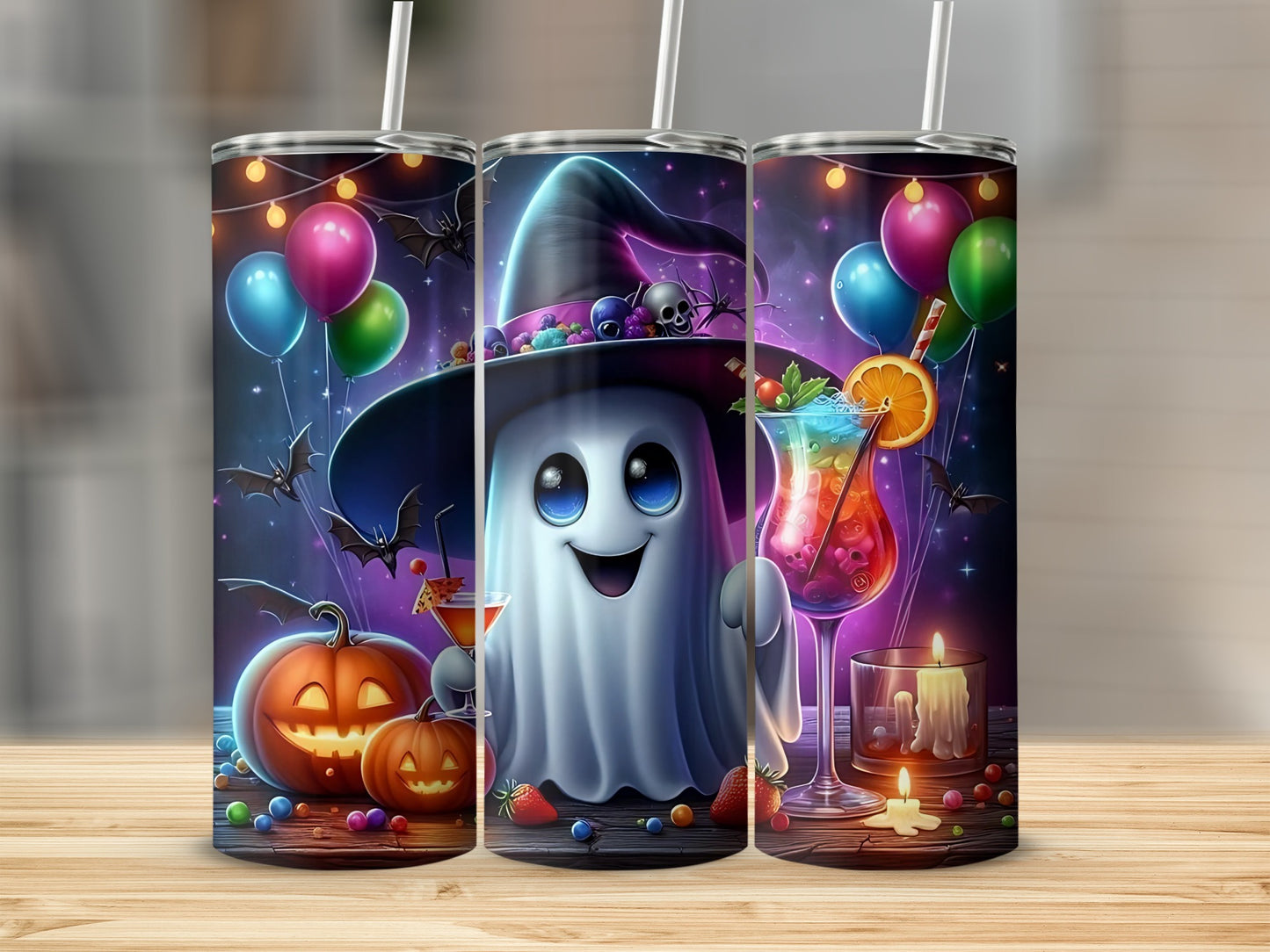 Three tumblers with a Halloween ghost, pumpkins, bats, and colorful drinks.