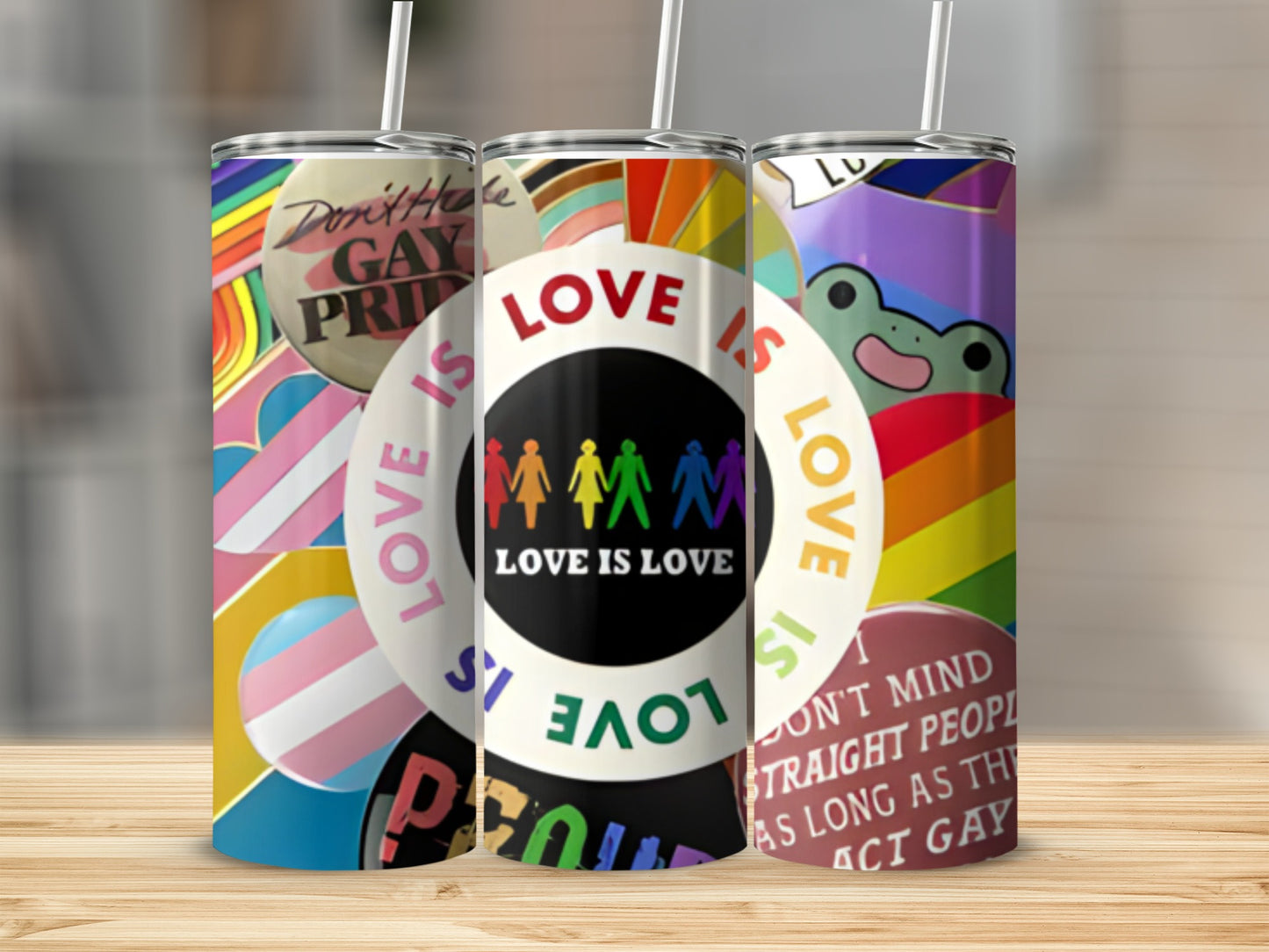 Rainbow pride flag tumbler with "Love is Love" and LGBTQ+ symbols.