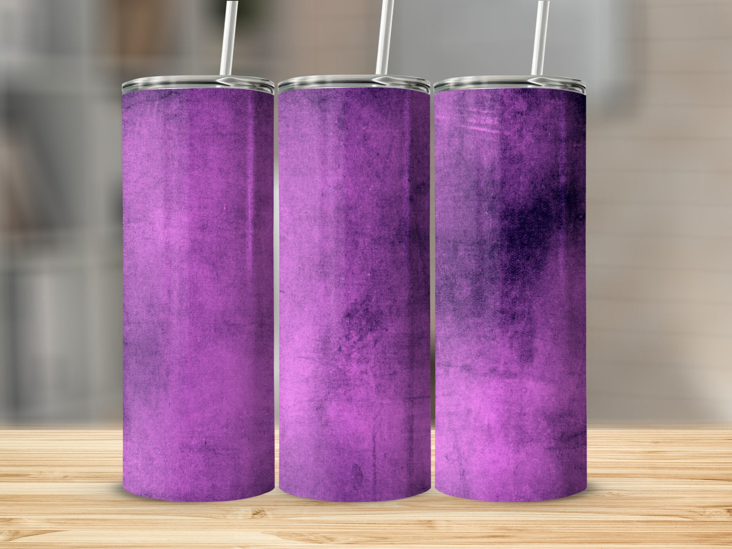 Three purple tumblers with textured surfaces and silver lids, arranged side-by-side.