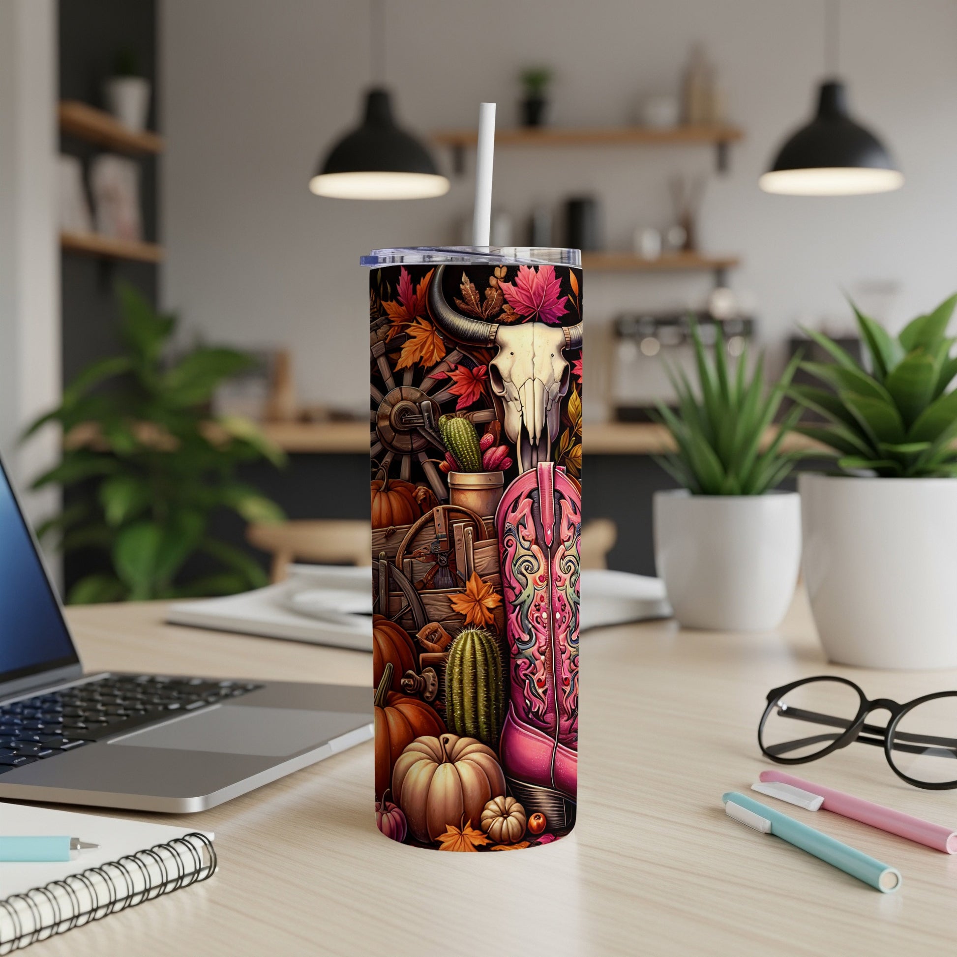 Tumbler with cow skull, cowboy boot, pumpkins, and fall leaves design.