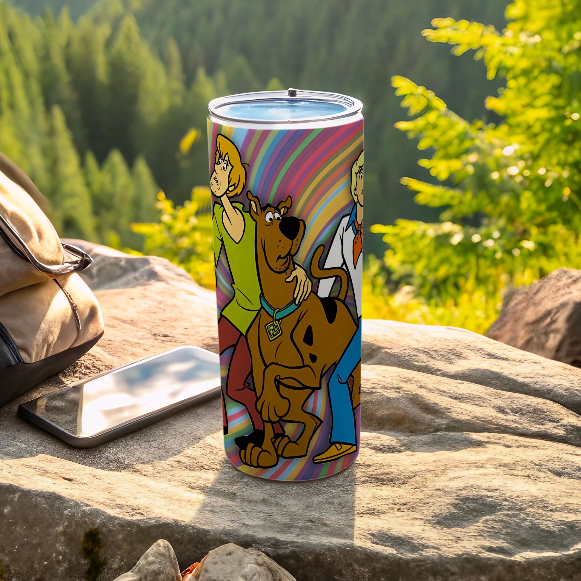Scooby-Doo and Shaggy on a colorful, patterned tumbler with a backpack and phone.