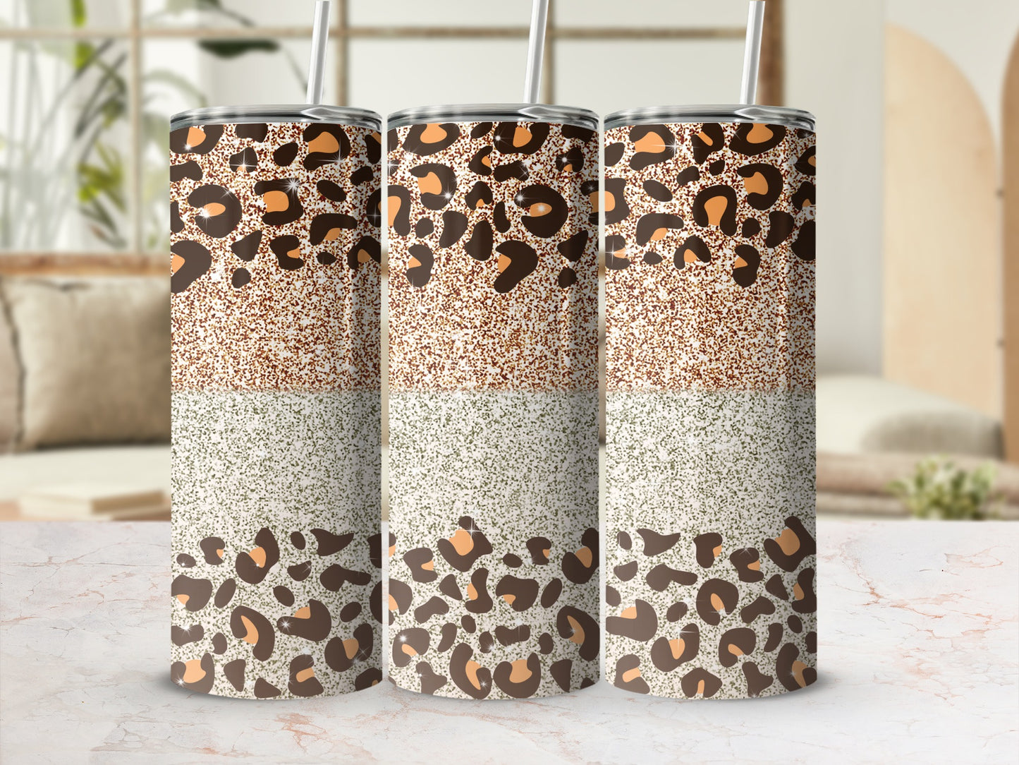 Three tumblers with leopard print and glitter designs stand in a row.