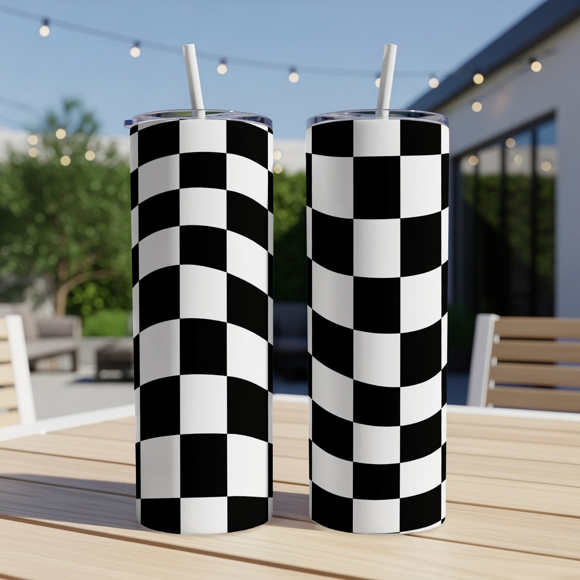 Two tall tumblers with a black and white checkered pattern.