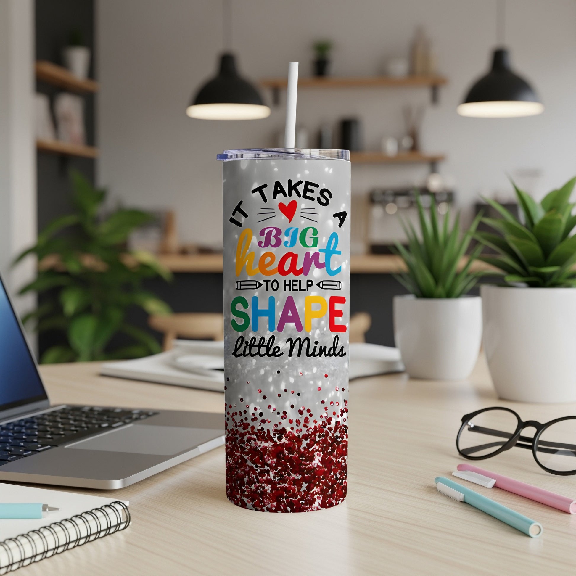 Tumbler with "It Takes a Big Heart to Help Shape Little Minds" text and glitter.