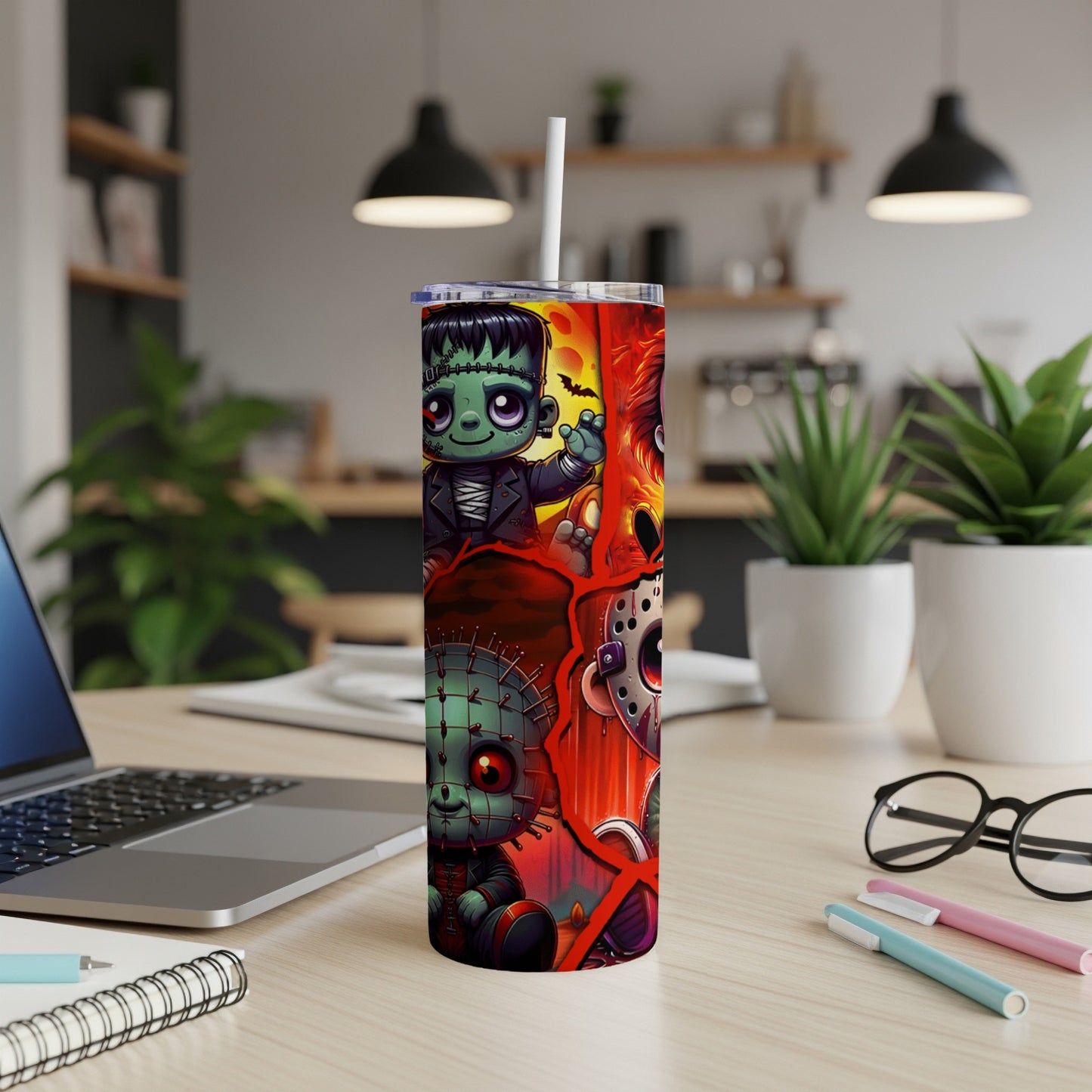 Frankenstein, Pinhead, and Jason Voorhees cartoon characters on a Halloween-themed tumbler cup.