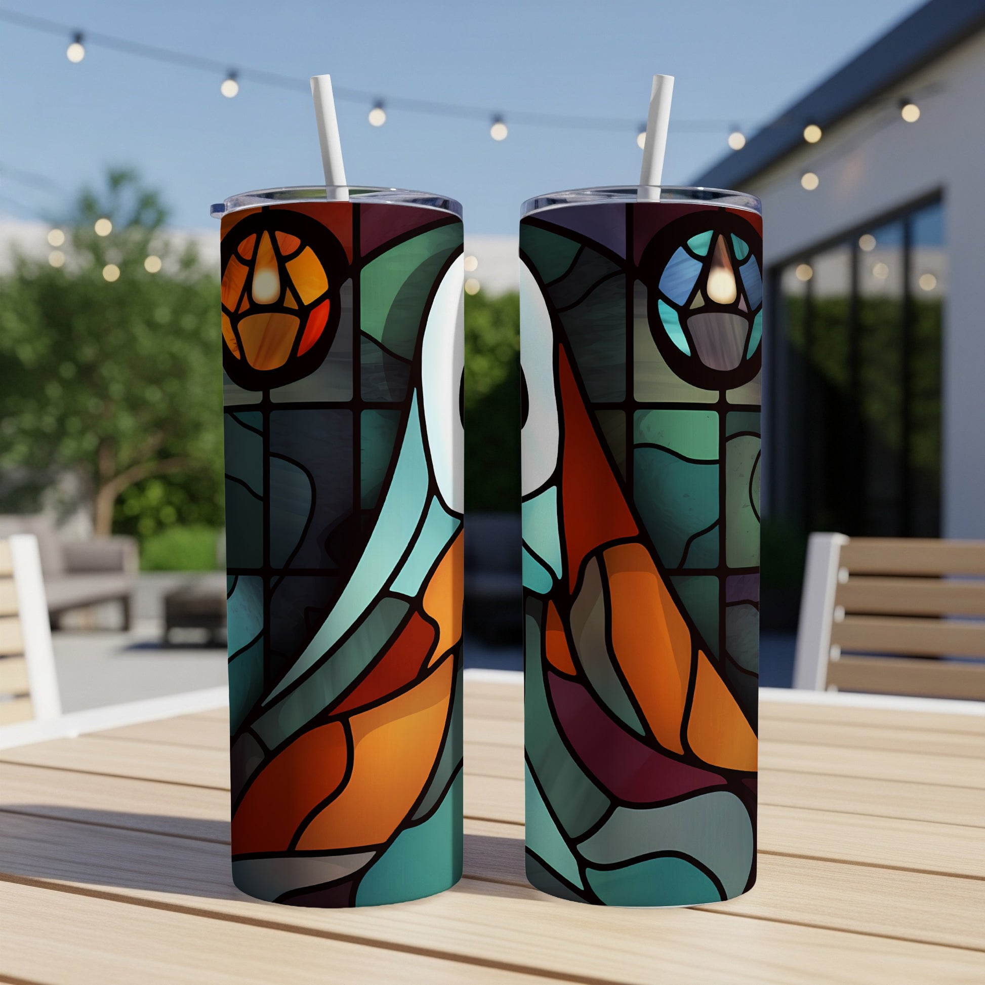 Two tumblers with stained-glass-style bird and floral designs.