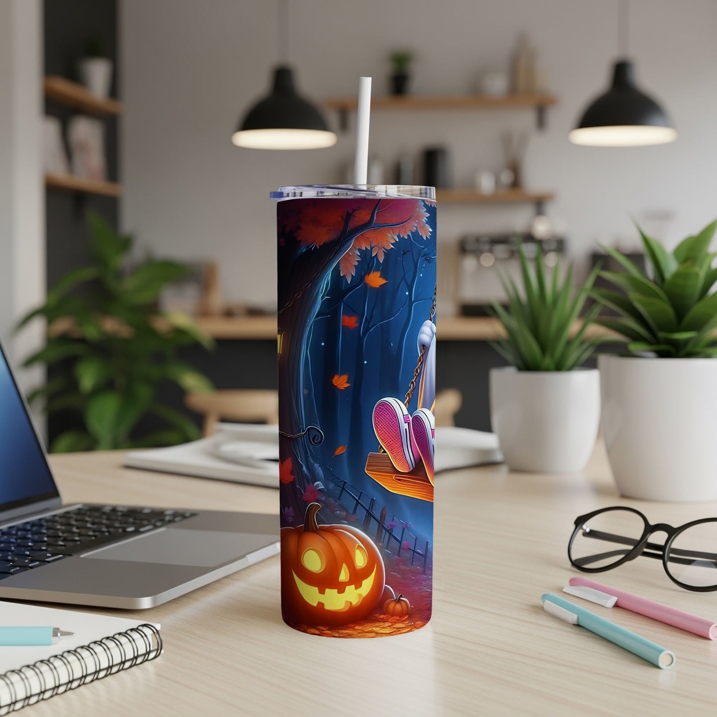 Tumbler with Halloween forest scene, glowing pumpkin, and character on a swing.