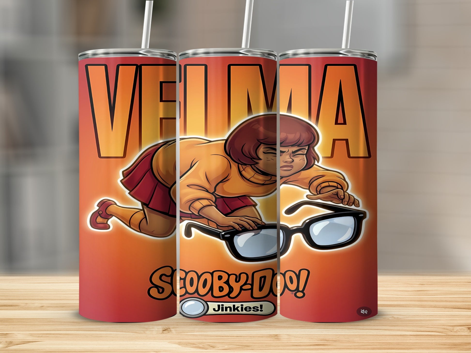 Velma holding glasses with "Scooby-Doo!" text on a red tumbler.