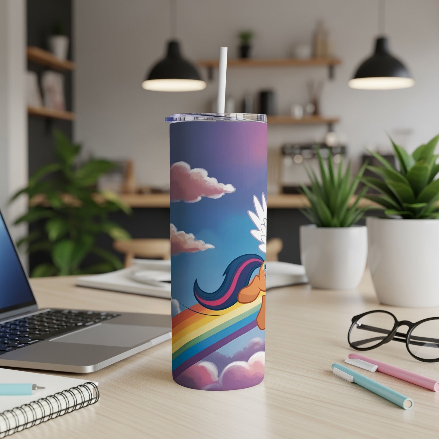 Rainbow unicorn on a purple gradient tumbler with clouds and a straw.