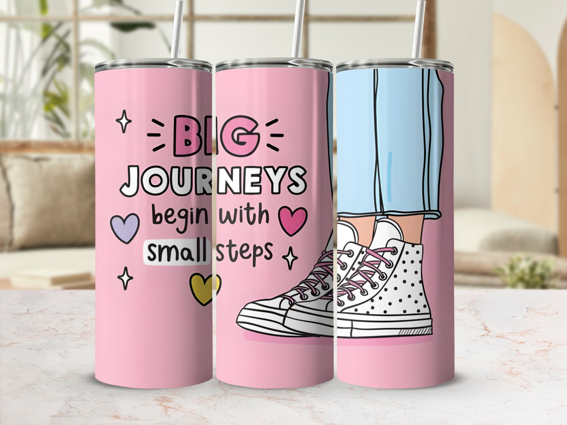 Pink tumbler with "Big Journeys Begin with Small Steps" and illustration of legs in sneakers.