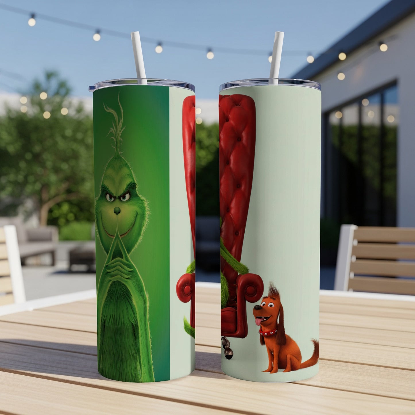 The Grinch and Max sit on a red chair, with the Grinch tumbler on the left.
