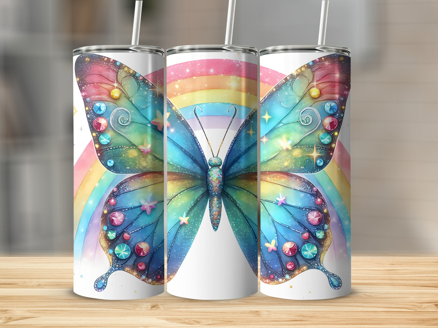 Three tumblers featuring a colorful butterfly and rainbow design.