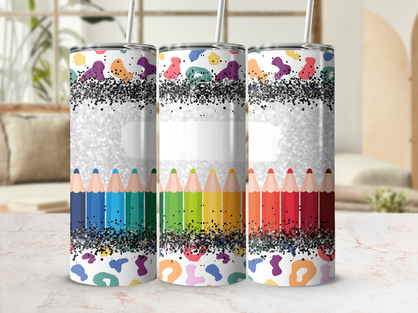 Tumbler with colorful pencil border and abstract speckled pattern.