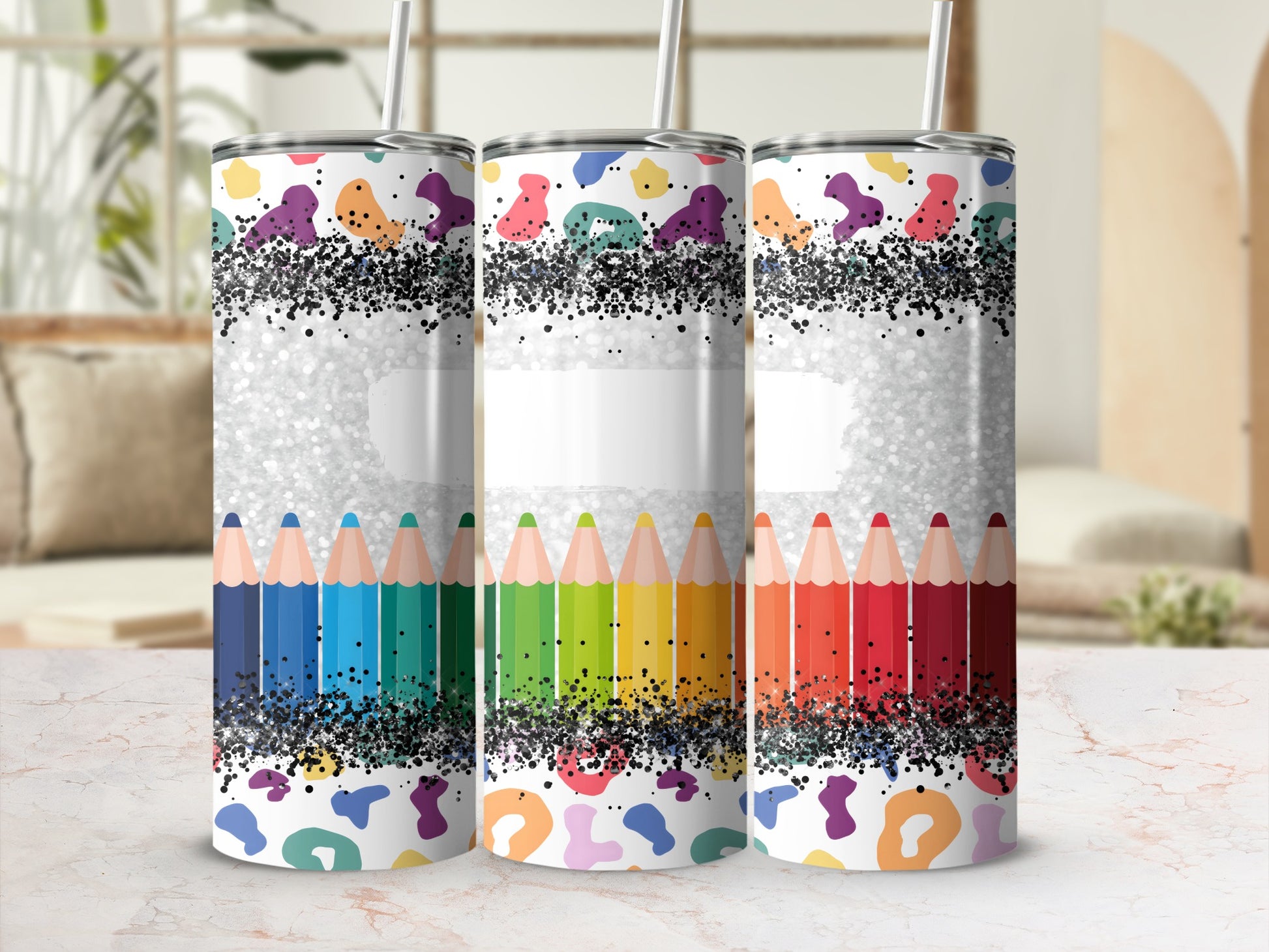 Tumbler with colorful pencil border and abstract speckled pattern.
