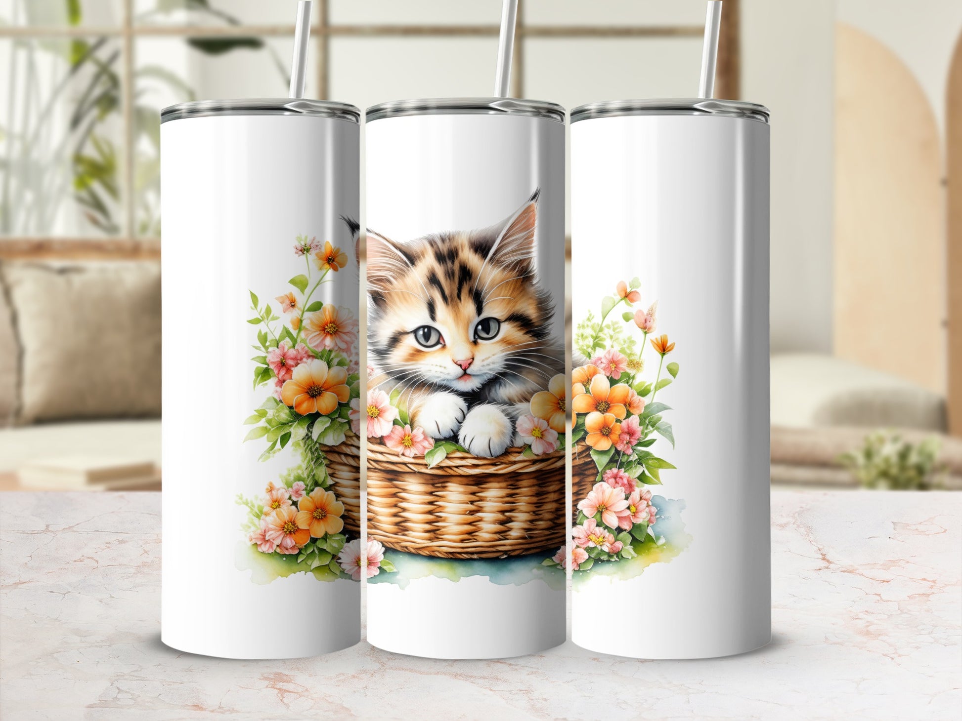 Three tumblers featuring a kitten in a basket surrounded by flowers.