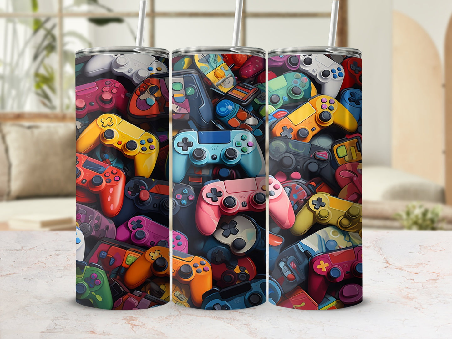Three tumblers adorned with a collage of colorful video game controllers.