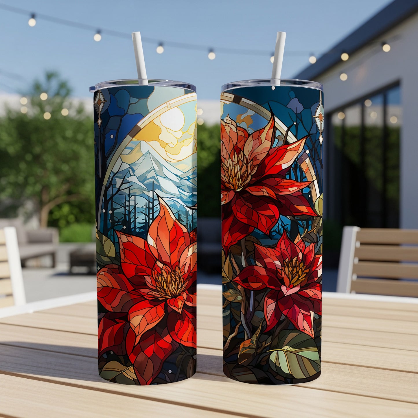 Two tall tumblers with poinsettia and stained-glass mountain design.