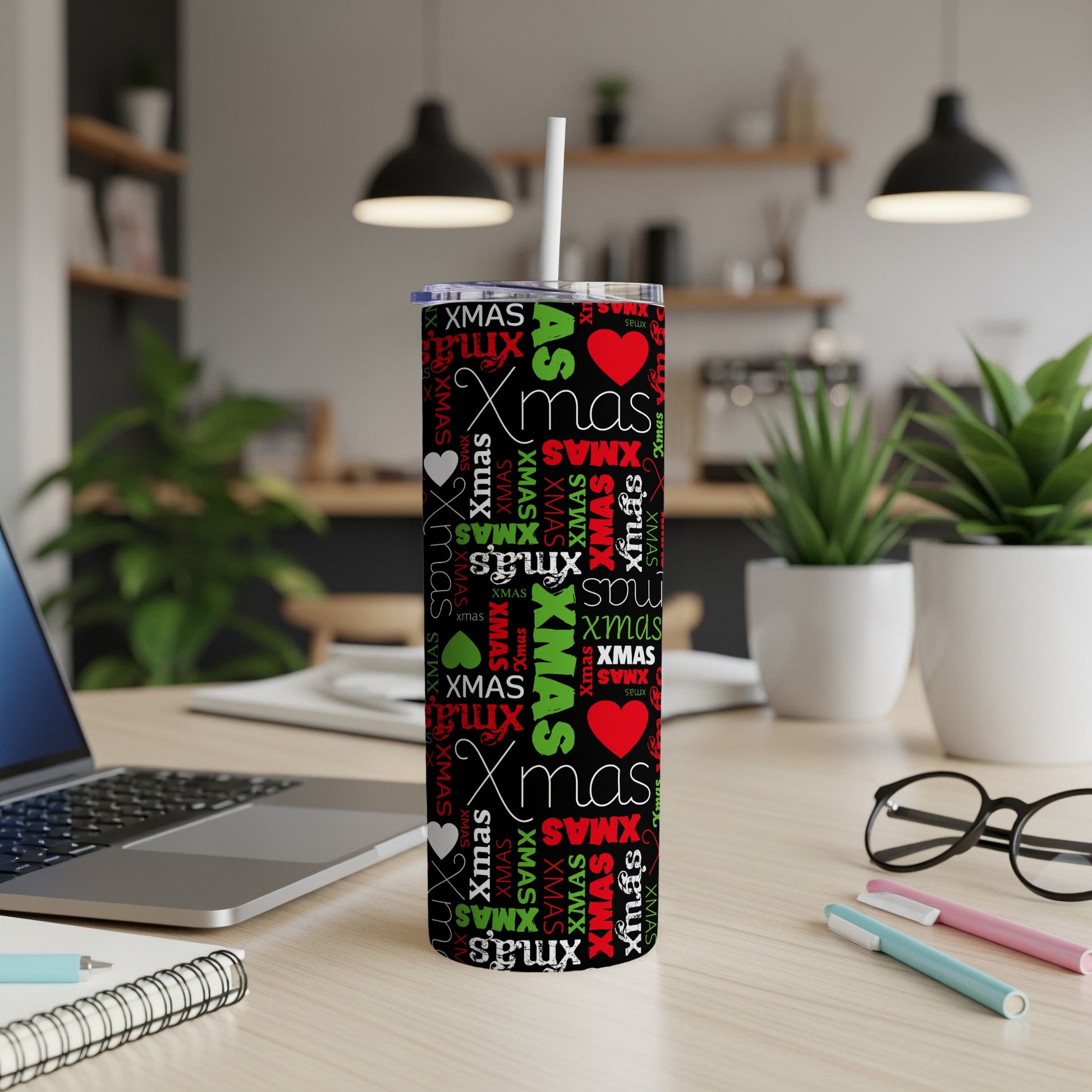Black tumbler with repeating red and green "XMAS" text and red hearts.