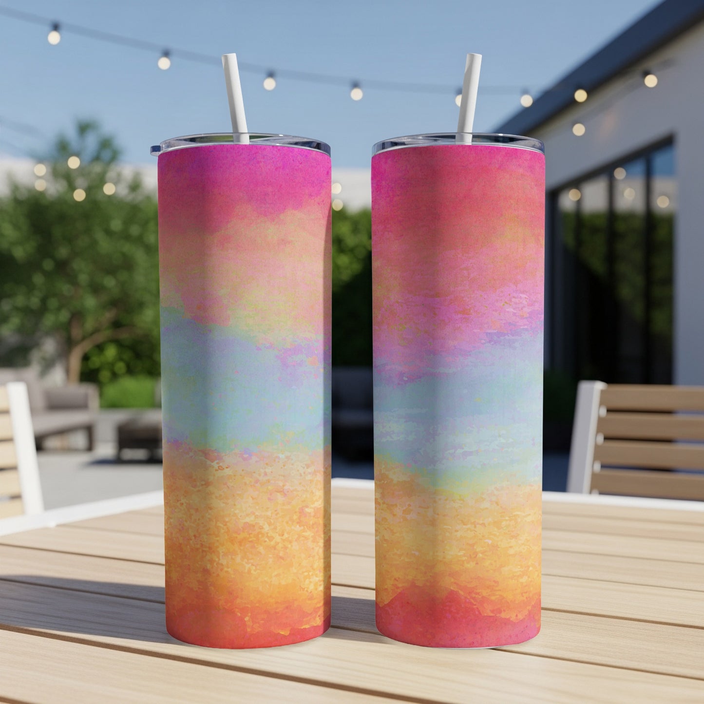 Two tumblers with a tie-dye watercolor design featuring pink, yellow, and blue hues.