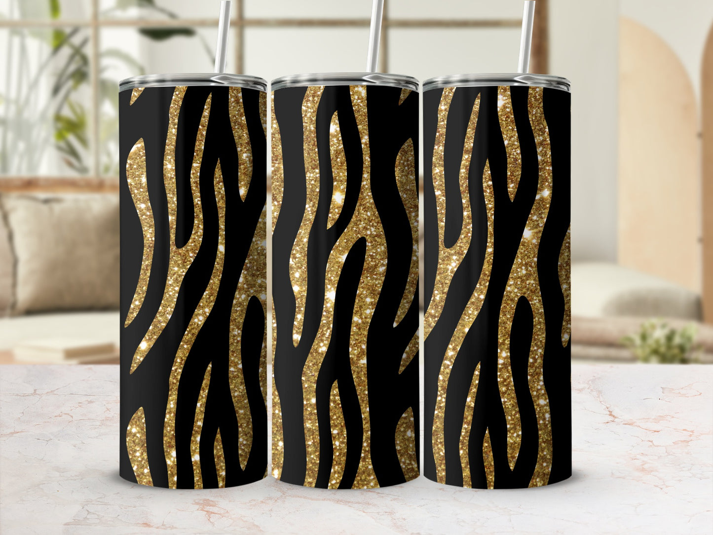 Three tumblers with black and gold glitter zebra stripe pattern.