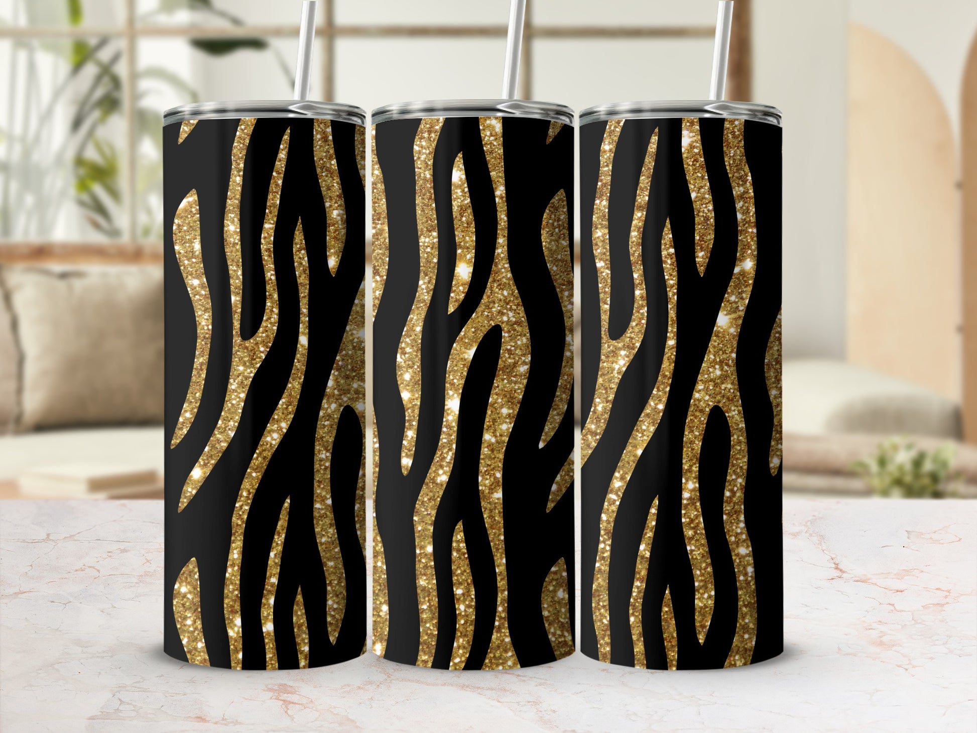 Three tumblers with black and gold glitter zebra stripe pattern.