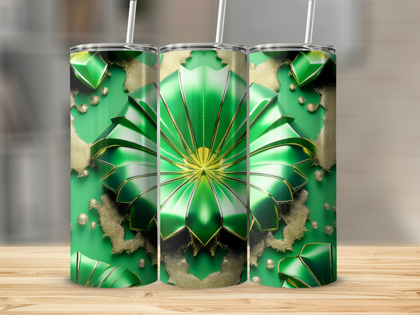 Three green tumblers with gold ornate floral patterns.
