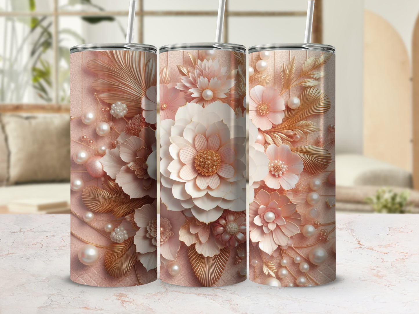 Three rose gold tumblers with intricate floral and pearl designs.