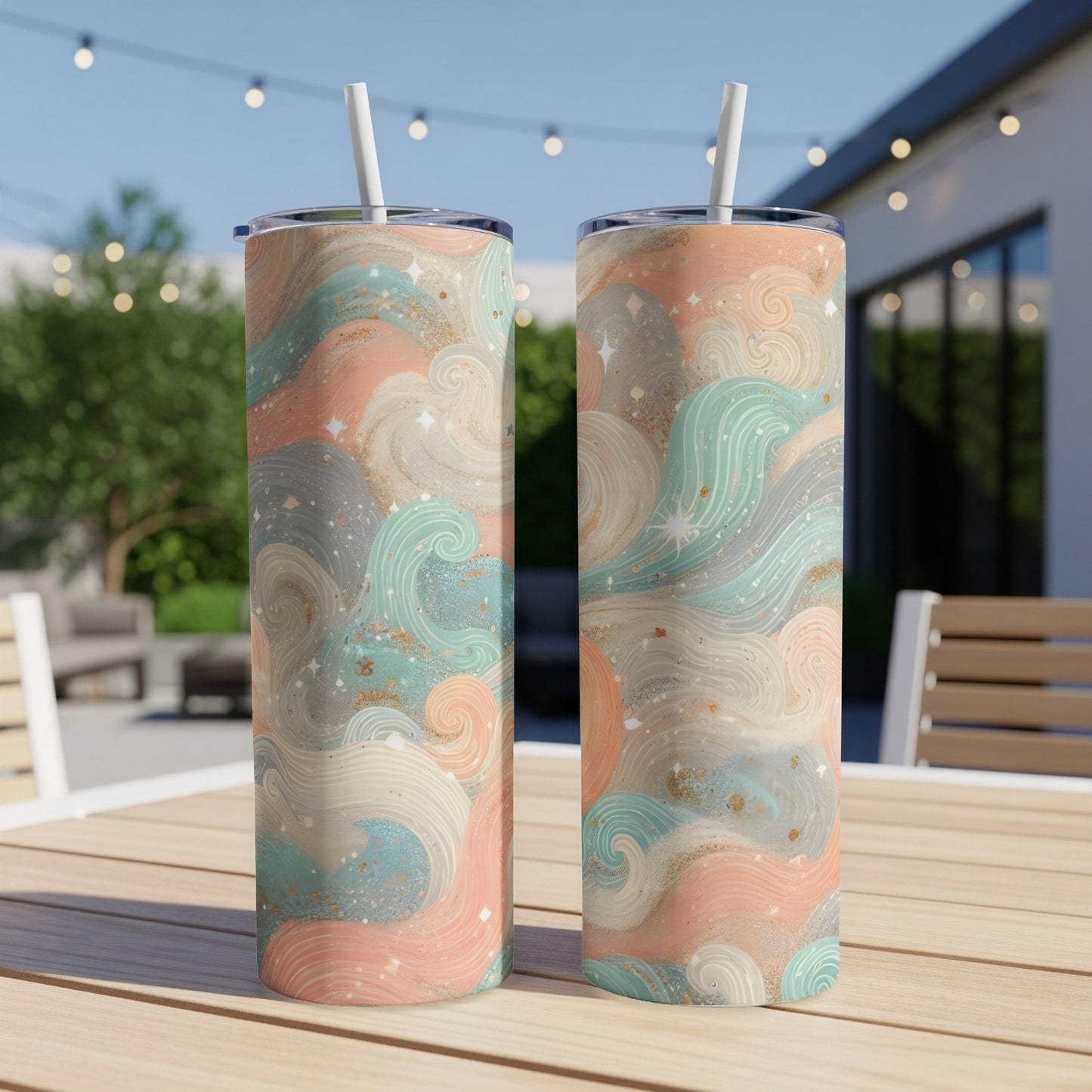 Two tumblers with a wavy, abstract pastel pattern on an outdoor table.