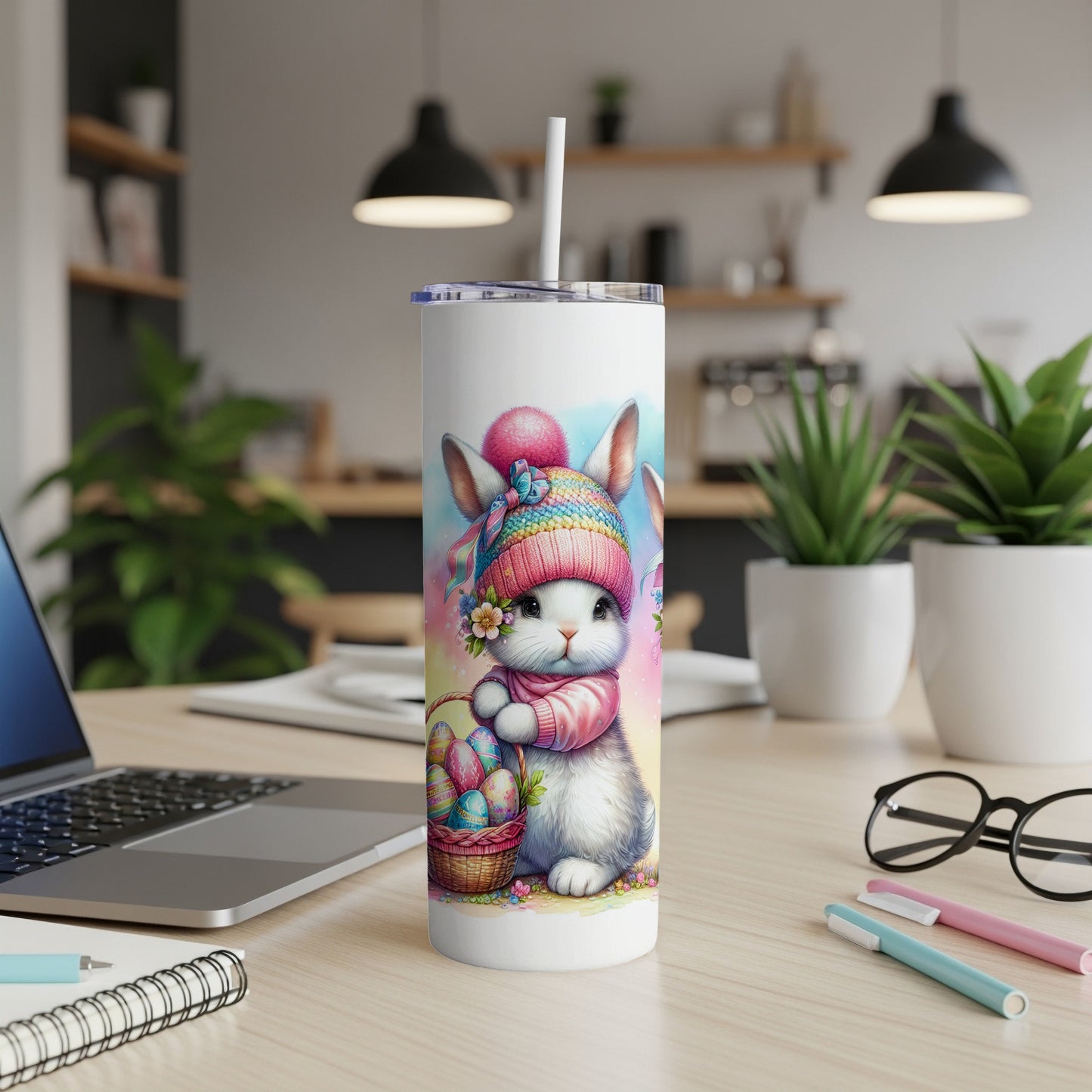 Easter bunny with basket of eggs and flowers on a white tumbler.